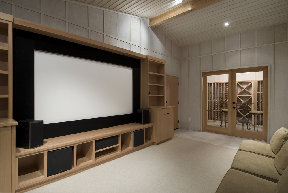 Home theater with wine tasting room big screen wood cabinets