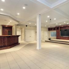 Basement in luxury home with step up TV area